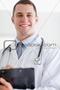 Close up of doctor with his notes