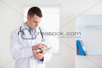 Doctor reading his notes carefully