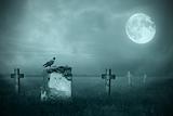 Gravestones in moonlight