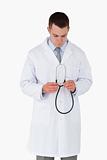 Doctor looking at his stethoscope