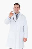 Smiling doctor using his stethoscope