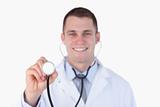 Close up of smiling doctor using his stethoscope