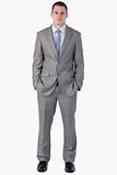 Young businessman with hands in his pocket