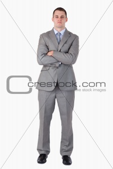 Serious businessman with arms folded