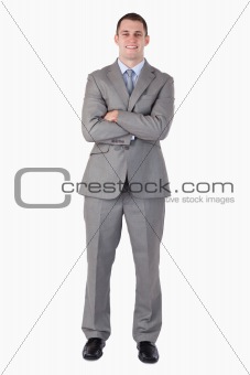 Smiling businessman with arms folded