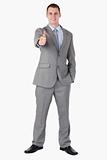 Smiling businessman giving thumb up