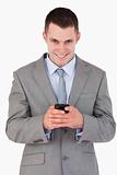 Close up of businessman getting good news via text message