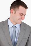 Close up of smiling businessman looking down