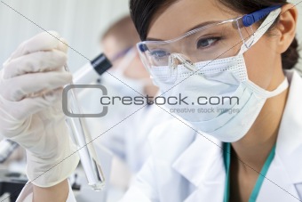 Chinese Female Woman Scientist With Test Tube In Laboratory