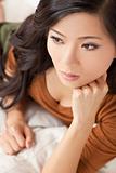 Beautiful Thoughtful Chinese Oriental Asian Woman Relaxing