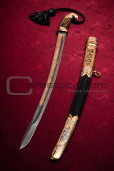 Ornated sword on red