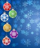 Hanging Ornaments on Blurred Snowflakes Background