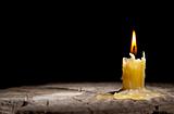 old candle on the black background