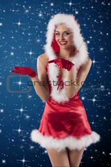 beauty girl in a red santa claus dress with white feathers