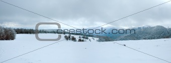 First winter snow and mountain panorama