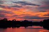 Red sunset sky on a reservoir