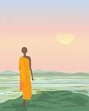 buddhist monk at sunset