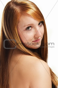portrait of a redhead girl looking over her shoulder