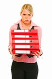 Tired of work modern female manager with pile of folders
