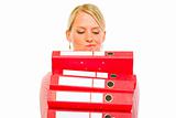 Confused woman with pile of folders

