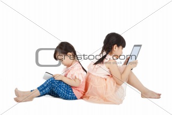 Two girls using touchscreen tablet PC
