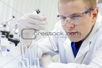 Male Scientist or Doctor With Test Tube In Laboratory