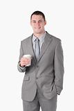 Portrait of a young businessman holding a cup of tea
