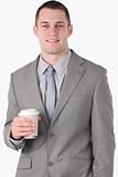 Portrait of a handsome businessman holding a cup of tea