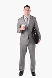 Portrait of a businessman holding a cup of tea and a computer bag