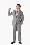 Portrait of a businessman pointing at a blank space