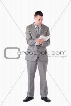 Portrait of a businessman taking notes