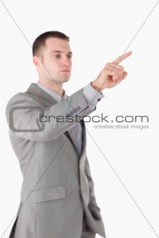 Portrait of a businessman touching something