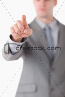 Portrait of a businessman's hand touching something
