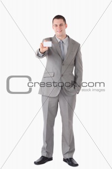 Portrait of a businessman showing a business card