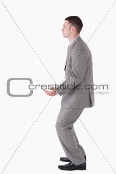 Portrait of a businessman carrying something