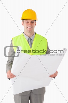 Portrait of a builder looking at a plan