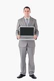 Portrait of a businessman holding a laptop