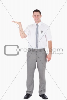 Portrait of a smiling office worker holding something