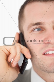 Close up of a handsome businessman making a phone call