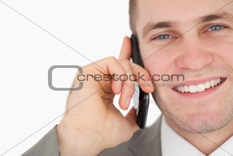 Close up of a happy businessman making a phone call