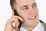 Close up of a handsome entrepreneur making a phone call