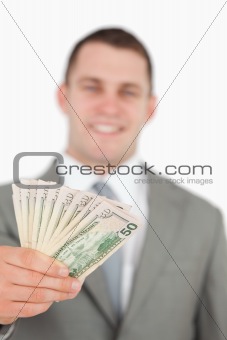 Portrait of a smiling businessman showing notes