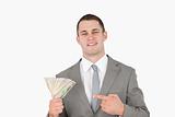 Businessman pointing at a wad of cash
