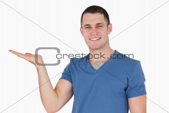 Smiling man holding something