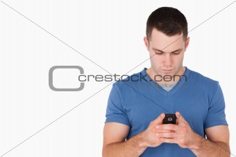 Young man sending text messages