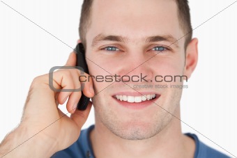 Close up of a smiling man on the phone