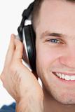 Close up of a smiling man listening to music