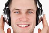 Close up of a happy man listening to music