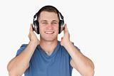 Smiling man listening to music