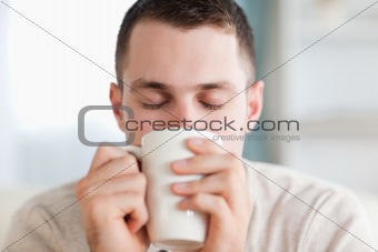 Calm man having a coffee